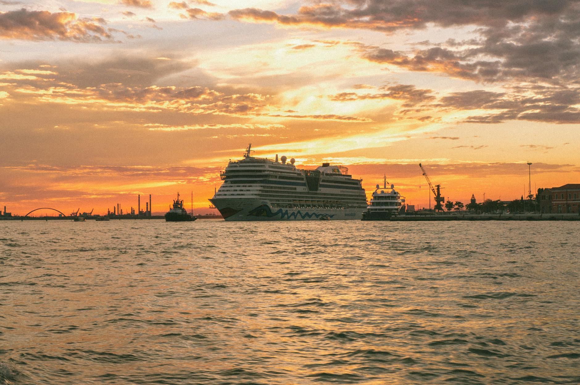 a ship in a marina during the golden hour
