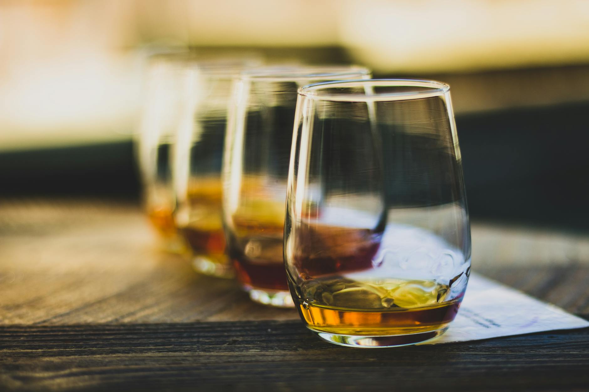 close up of drinking glasses with whisky