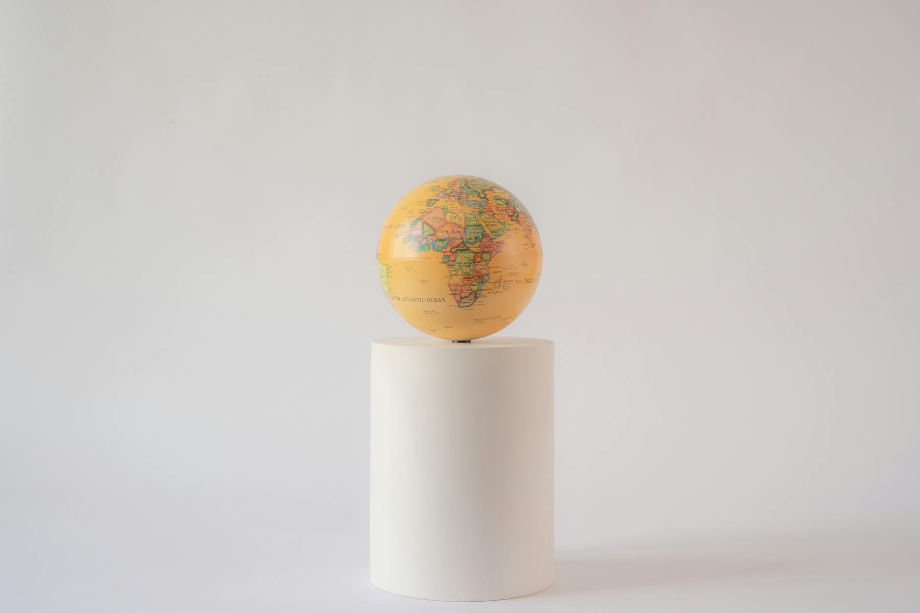 yellow globe on a tube stand