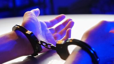 a person with black handcuffs