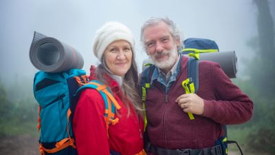 a couple smiling at the camera