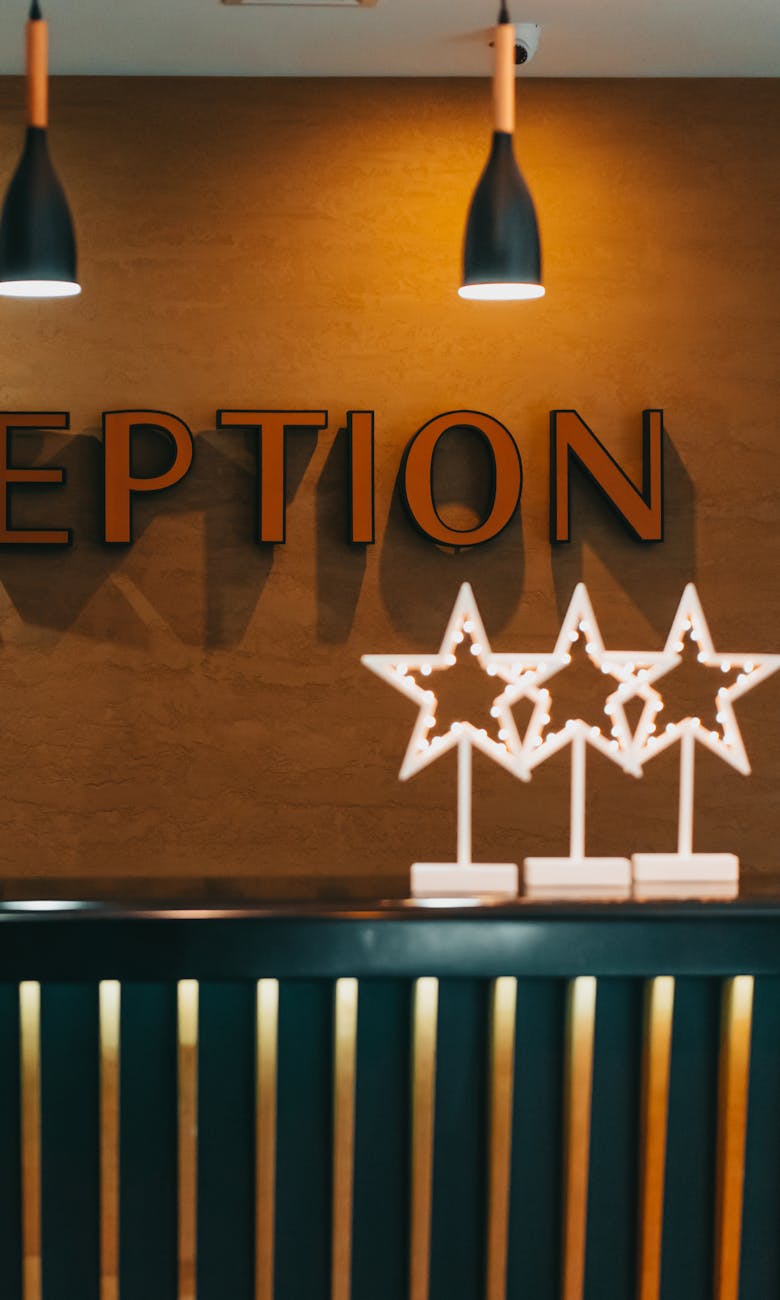 illuminated decoration in the shape of stars under the reception sign in a hotel
