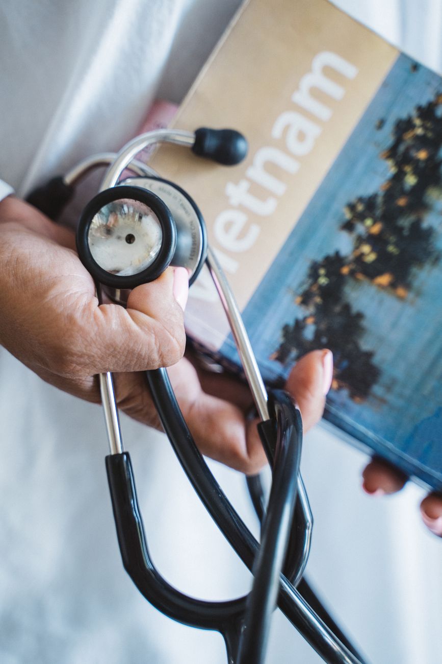 black and silver stethoscope on a person s hand