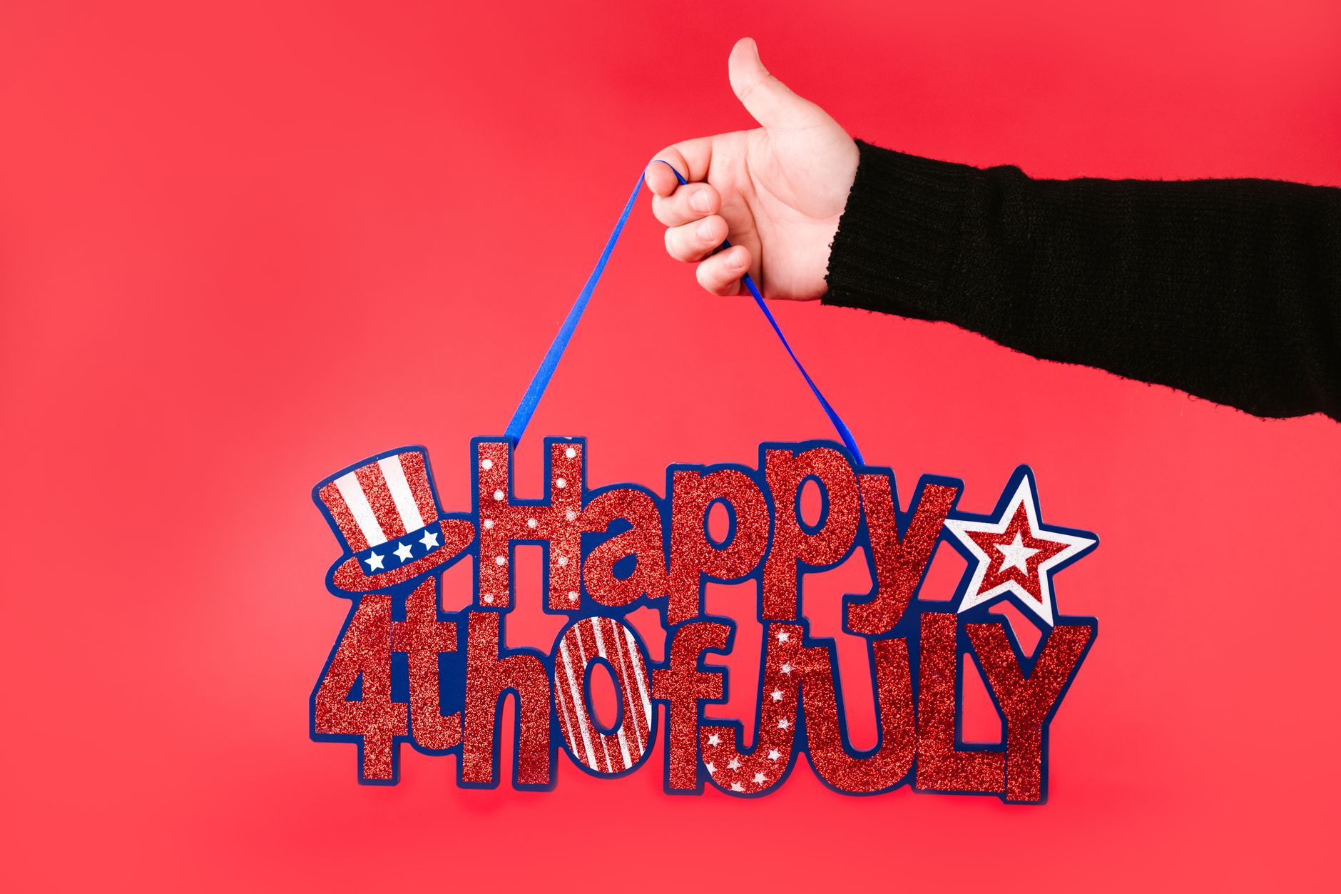 a person holding a banner happy fourth of july