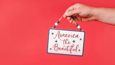 hand holding a hanging decoration