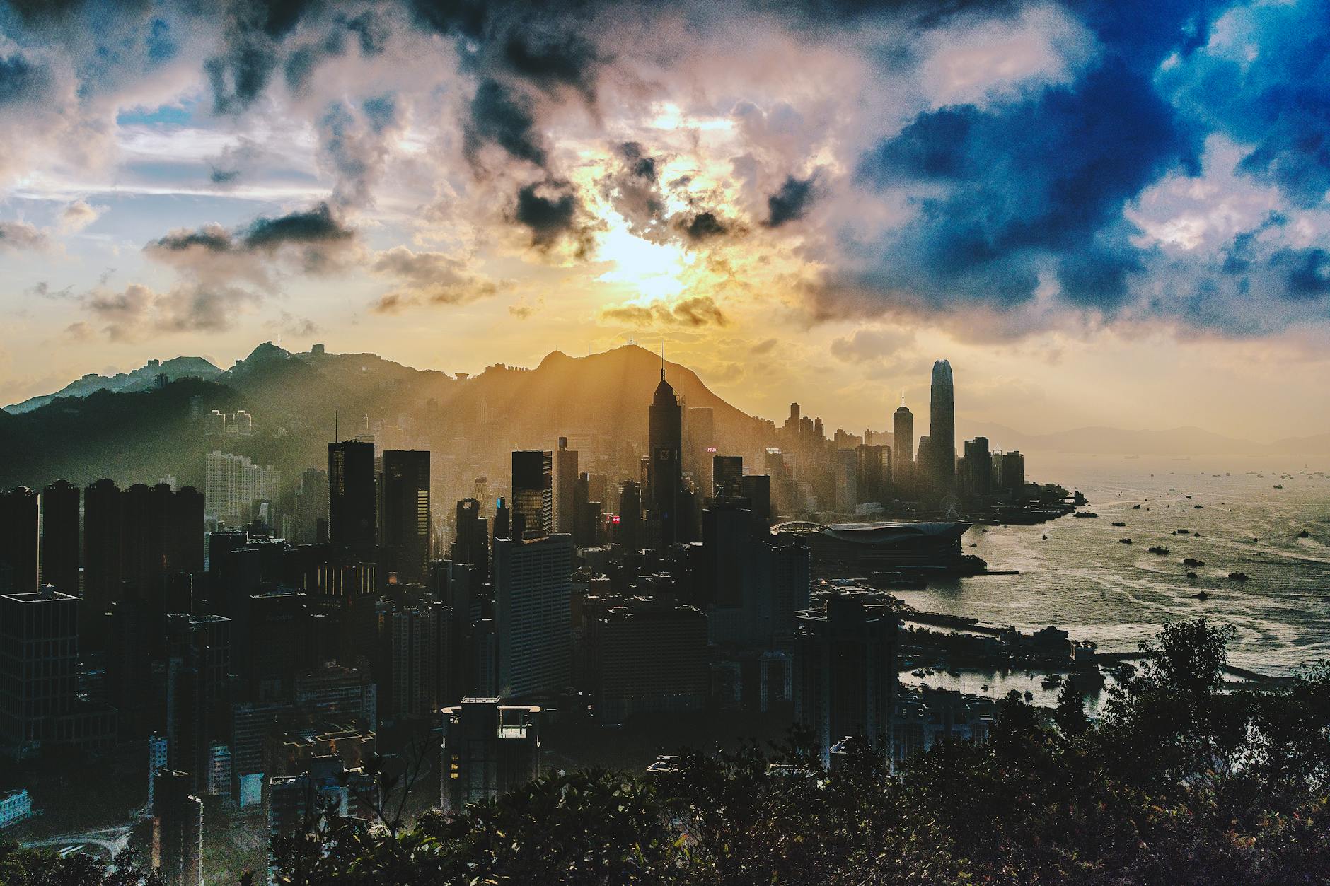 bird s eye view of city near ocean during sunset