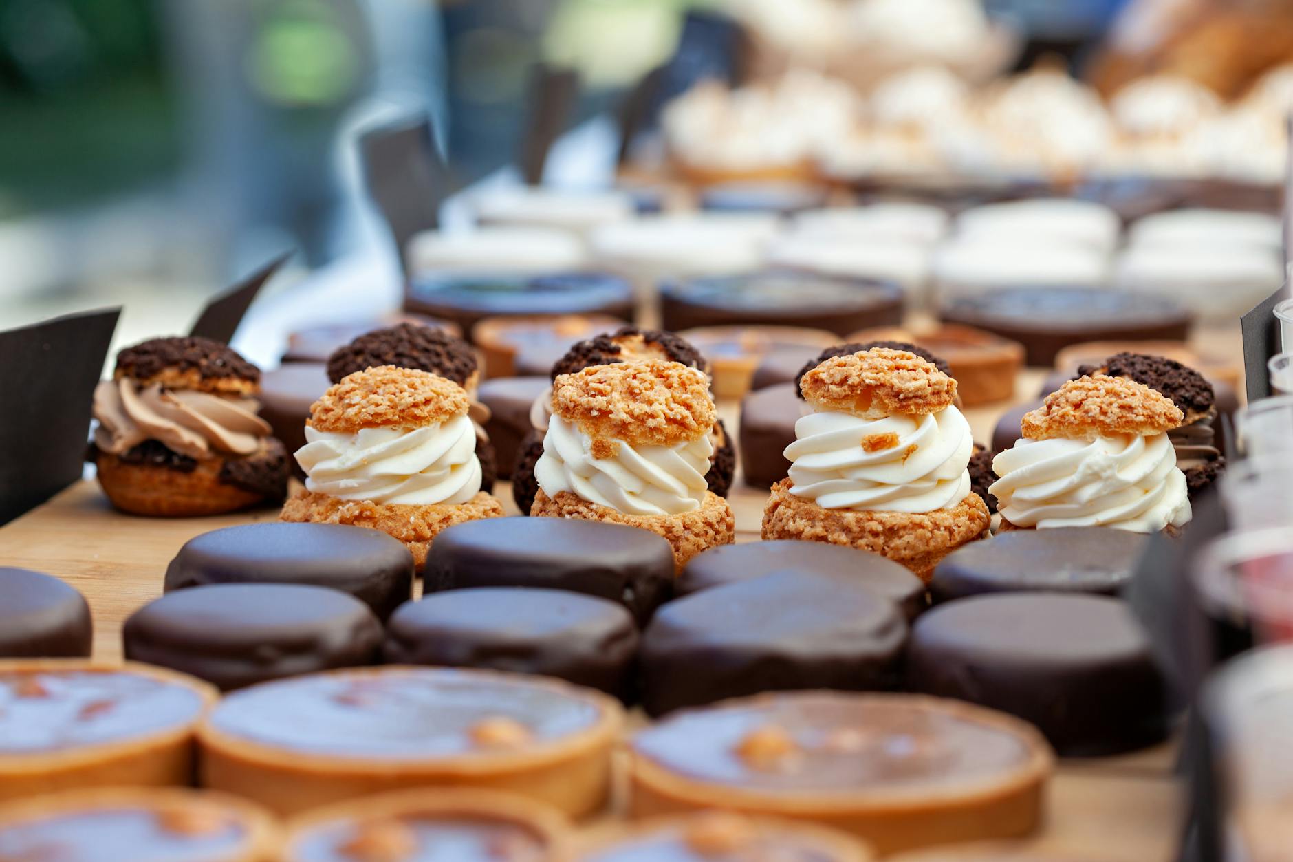 creamy cream puffs in tilt shift lens