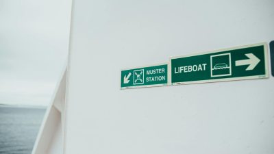 muster station and lifeboat information signs