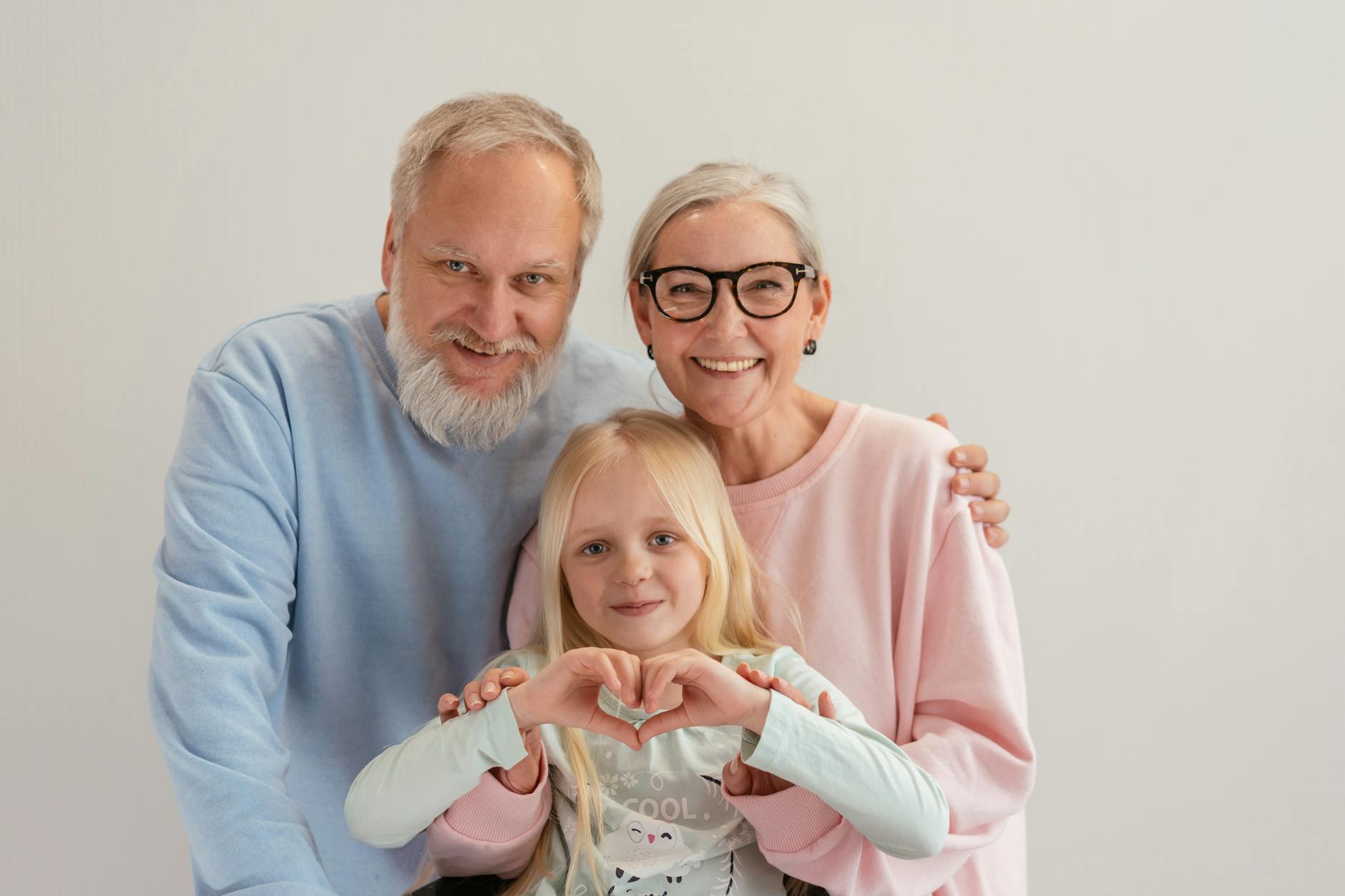 grandparents with their granddaughter