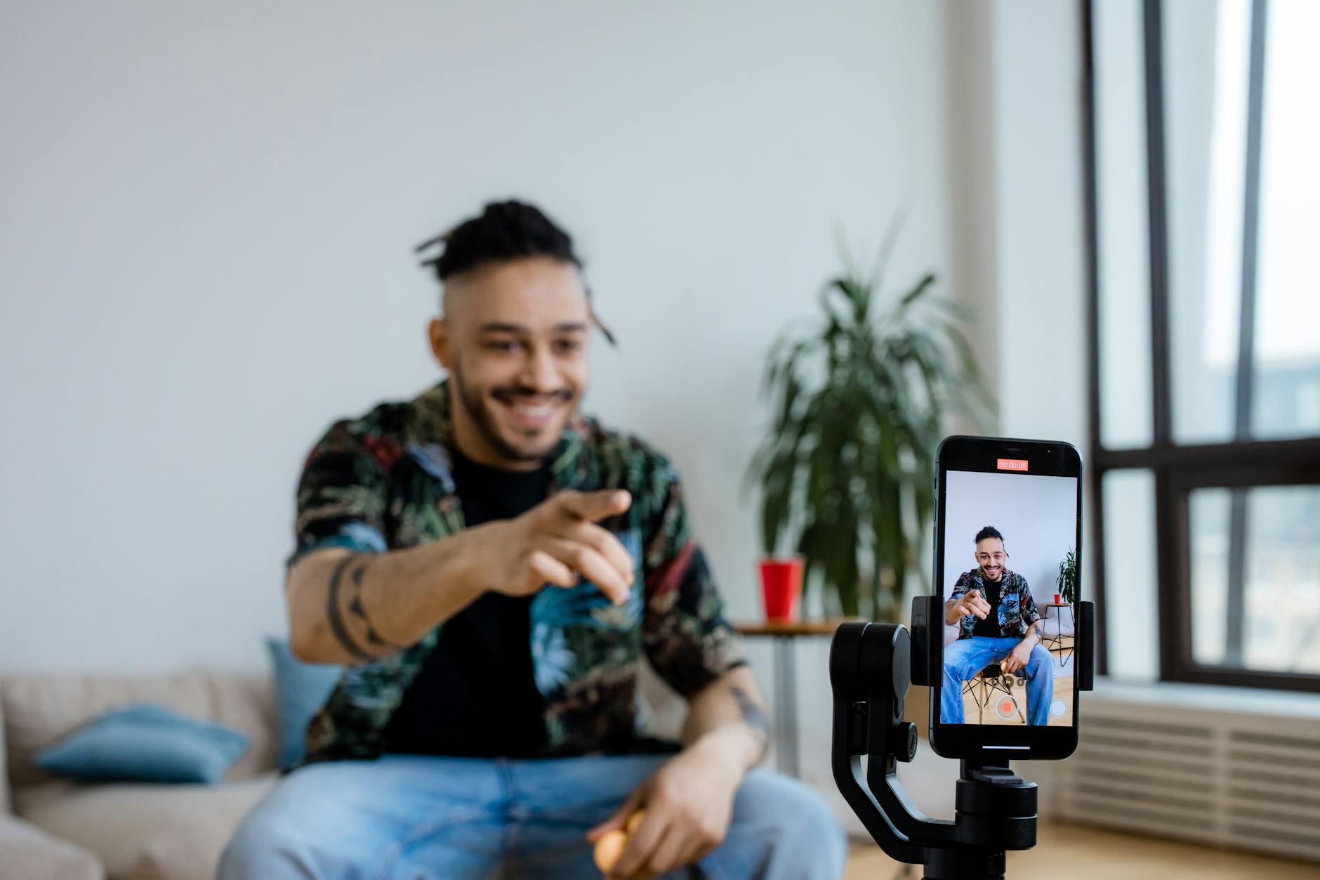 a man doing blogging using smartphone