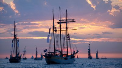 sailboats on sea during dusk