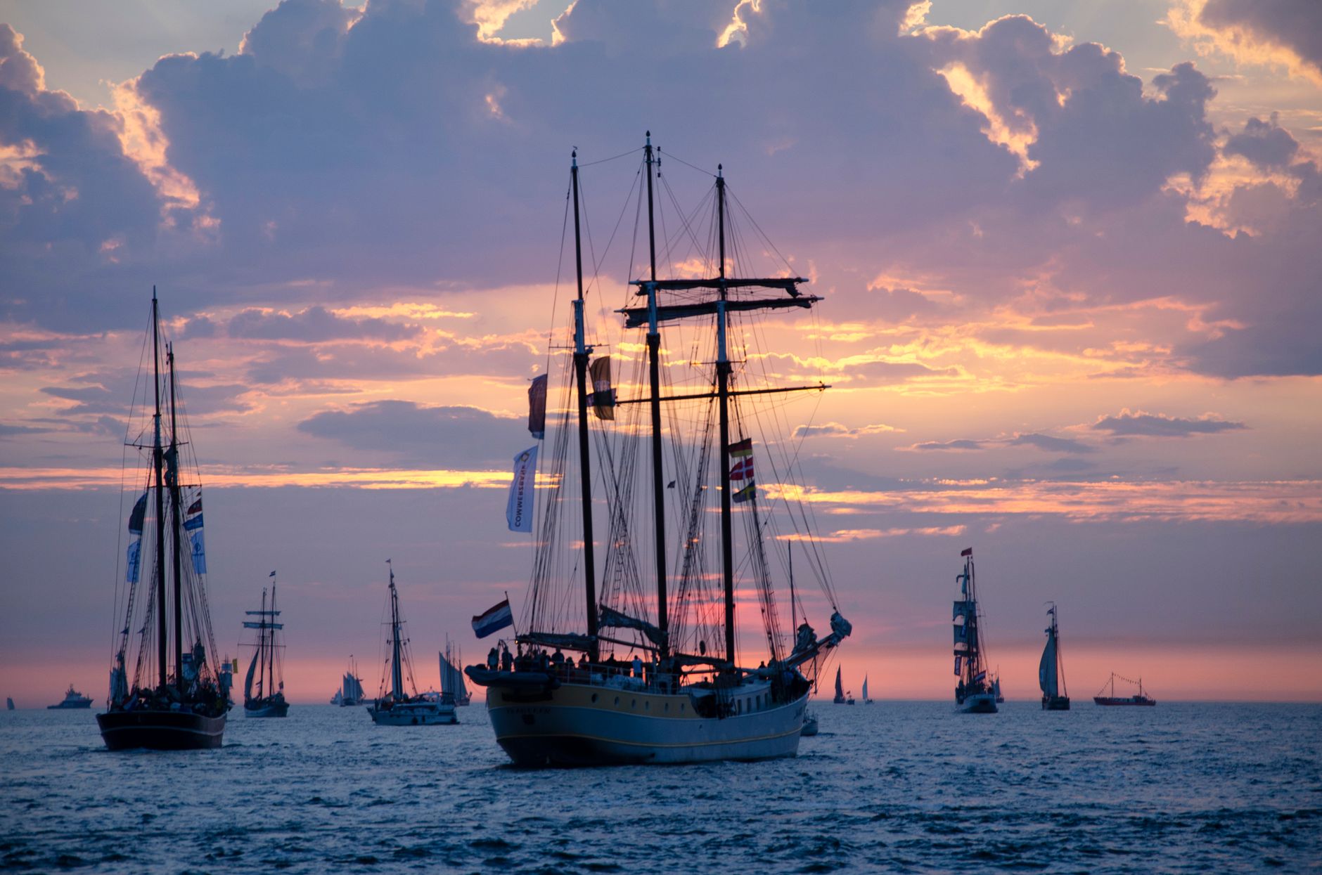 sailboats on sea during dusk