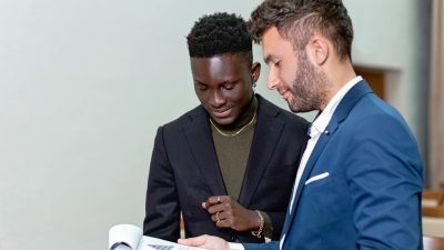 two men working together