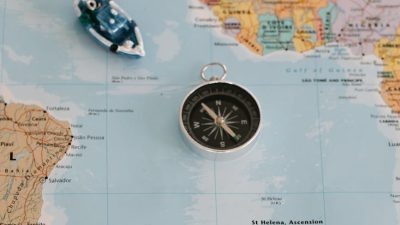 tiny ships near the metal pocket compass