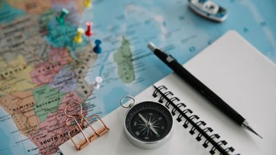 still life with notebook and pined map