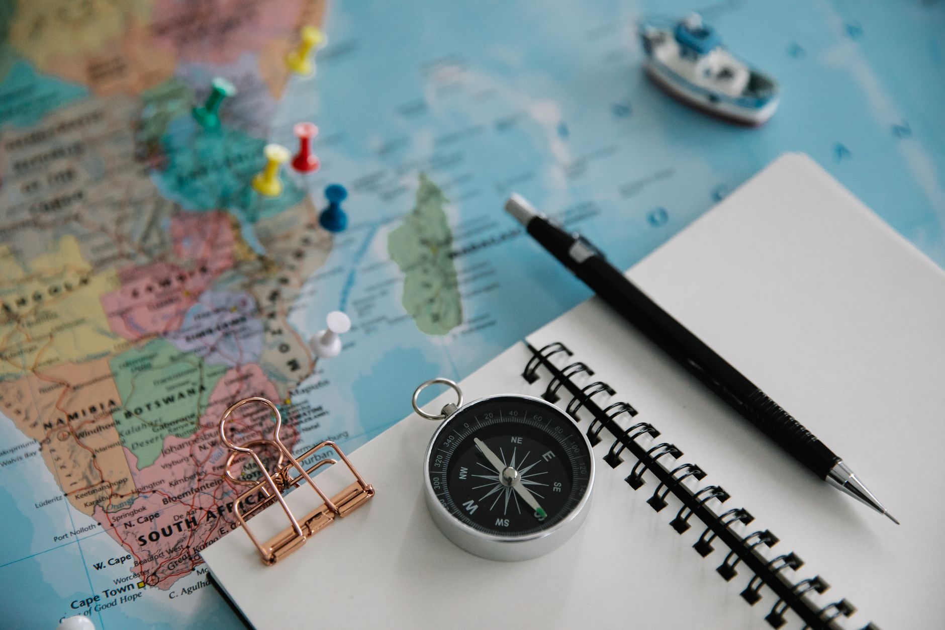still life with notebook and pined map