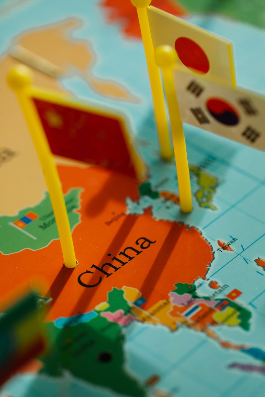 close up shot of world map with flaglets