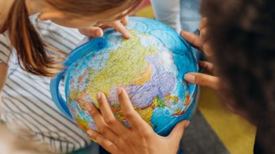 a children looking the globe