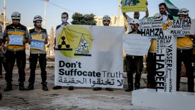 people holding protest signs