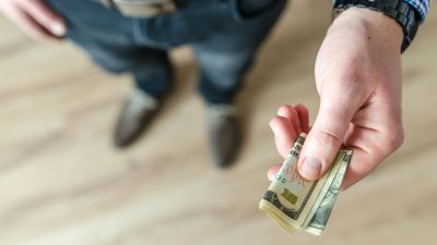 person holding banknote