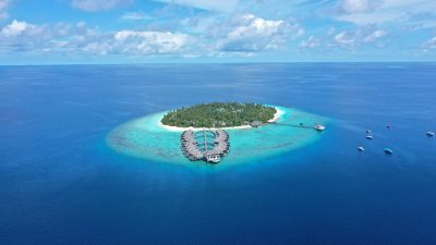 drone shot of a private island in the middle of the sea