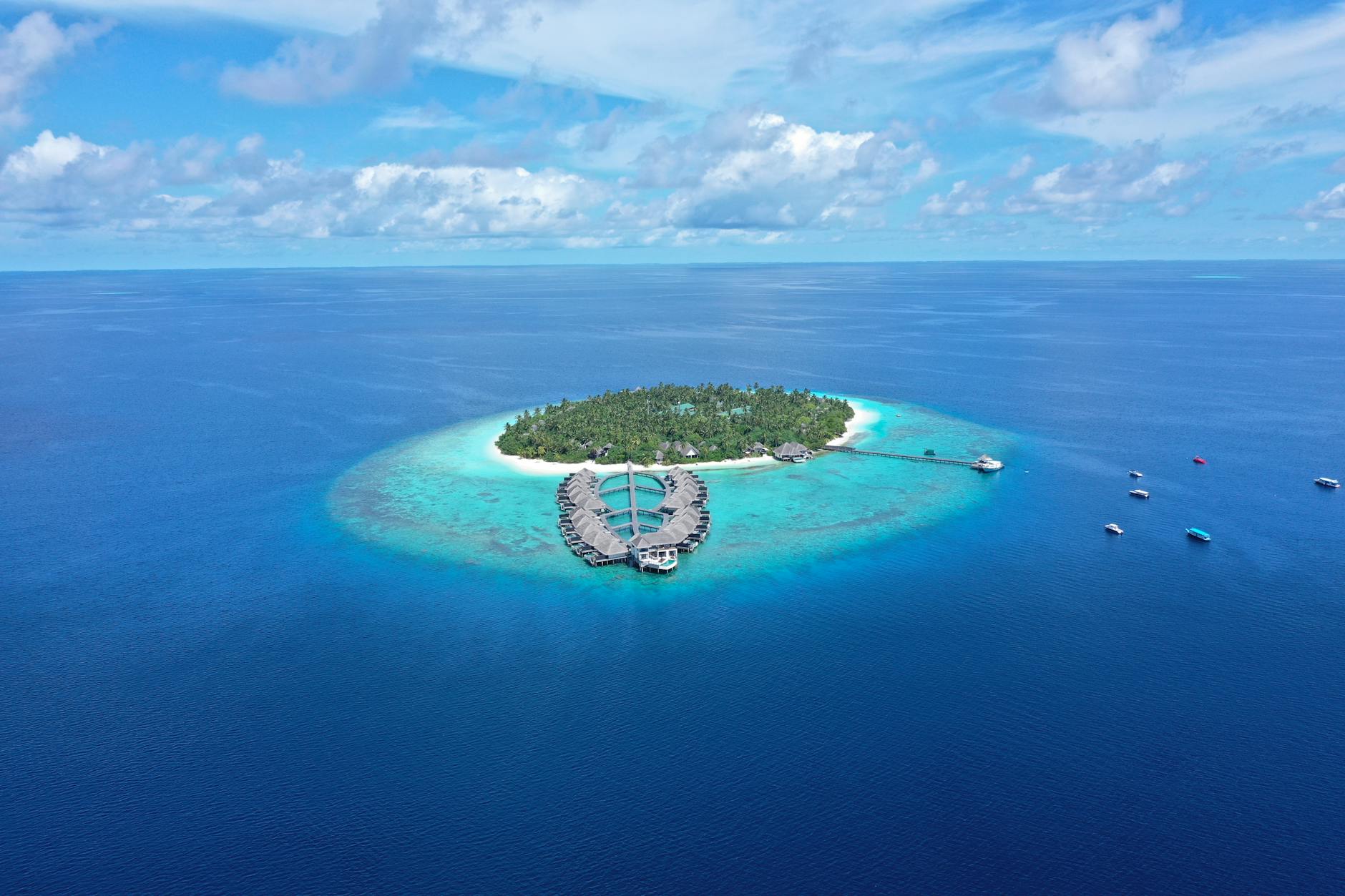 drone shot of a private island in the middle of the sea