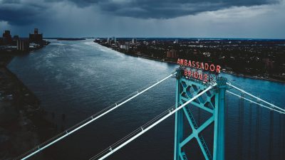 drone shot of the ambassador bridge over the detroit river