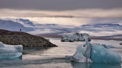 icebergs on body of water