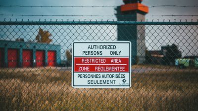 signage hanging on a mesh wire
