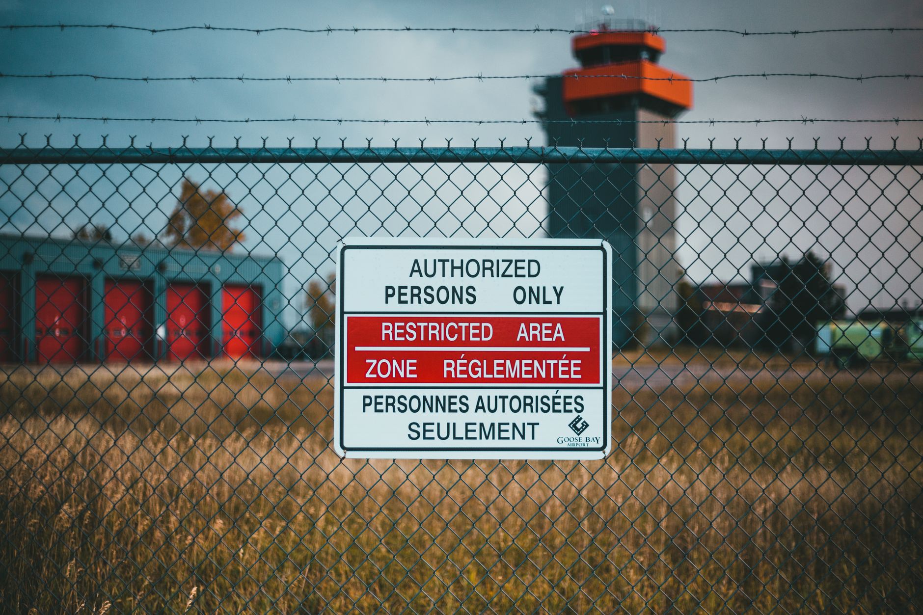 signage hanging on a mesh wire