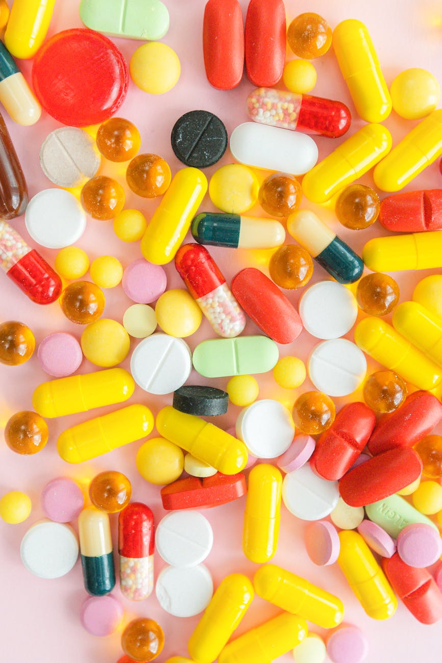 medicines on pink surface