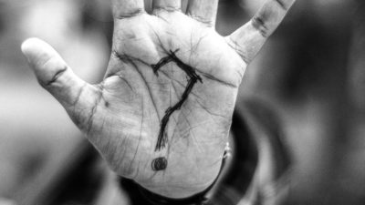 person with question mark on his palm