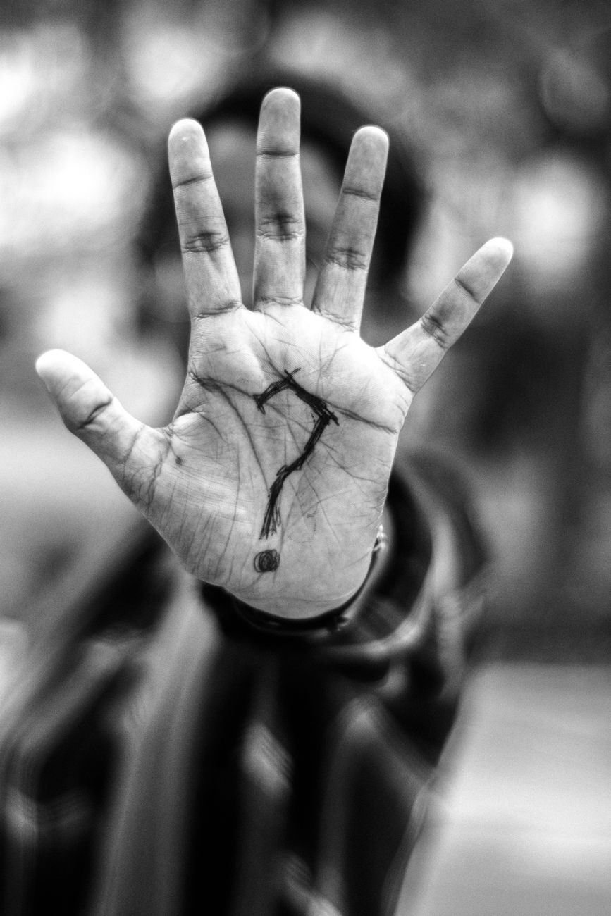 person with question mark on his palm