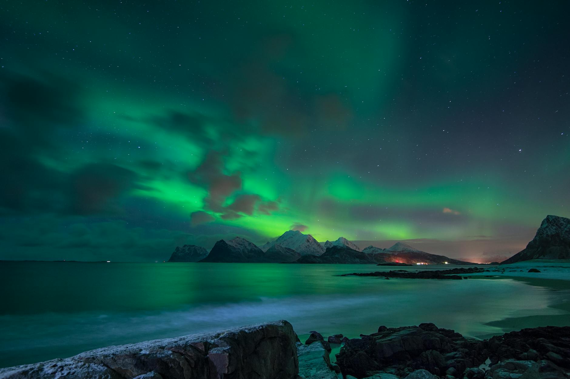aurora borealis over body of water