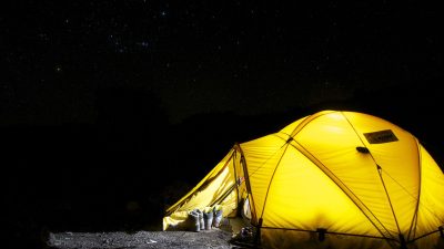 yellow tent under starry night