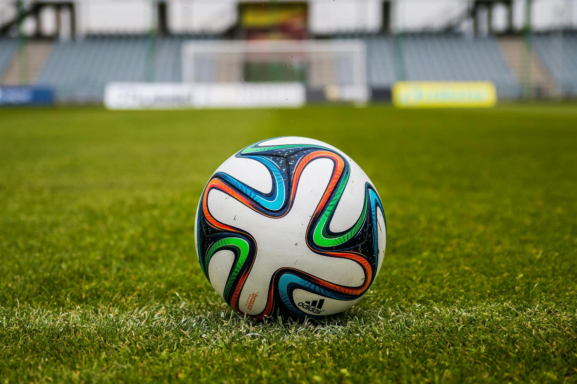 adidas soccer ball on grass open field